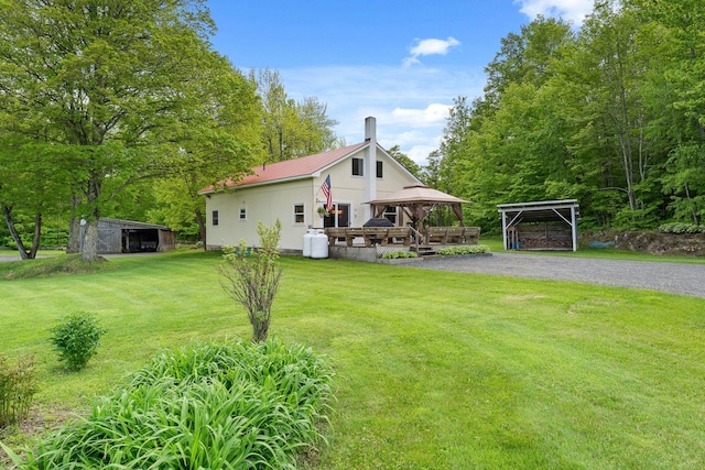 122 Wallace Rd, Northfield, VT 05663 - view of front of home featuring a gazebo, a chimney, a front lawn, gravel driveway, and metal roof