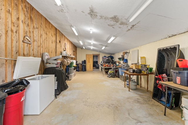 122 Wallace Rd, Northfield, VT 05663 - basement featuring wood walls and a workshop area