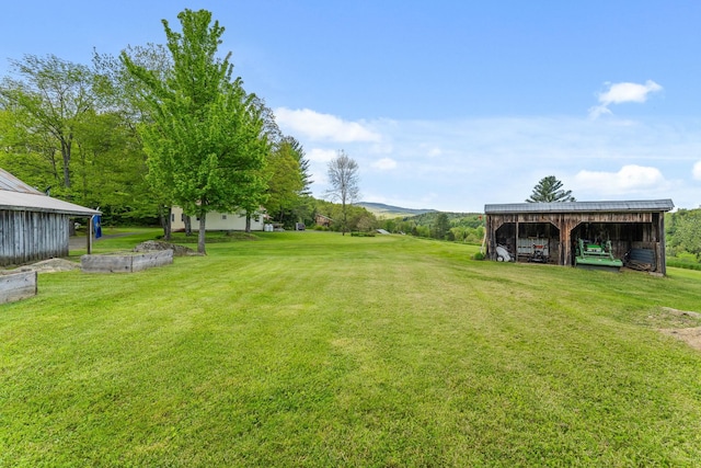 122 Wallace Rd, Northfield, VT 05663 - view of green lawn featuring an outbuilding and a carport