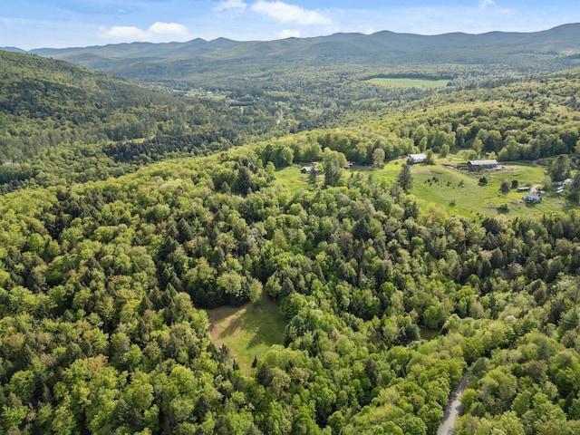 122 Wallace Rd, Northfield, VT 05663 - drone / aerial view of a heavily wooded area and a mountain backdrop