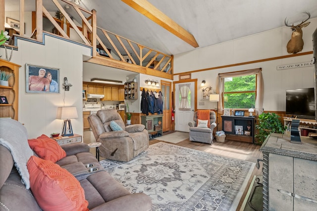 122 Wallace Rd, Northfield, VT 05663 - living room featuring light wood finished floors, high vaulted ceiling, and beam ceiling