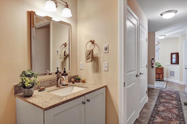 28A Black Walnut Ln Unit A, Jericho, VT 05465 - bathroom with vanity and baseboards