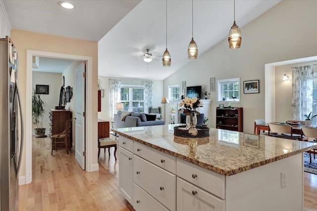 28A Black Walnut Ln Unit A, Jericho, VT 05465 - kitchen featuring freestanding refrigerator, ceiling fan, light wood-style flooring, light stone counters, and white cabinetry