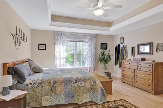 28A Black Walnut Ln Unit A, Jericho, VT 05465 - bedroom featuring light wood-style floors, a tray ceiling, and a ceiling fan