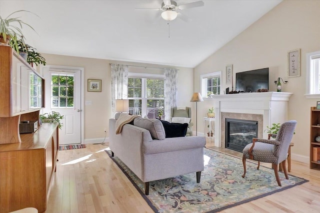 28A Black Walnut Ln Unit A, Jericho, VT 05465 - living area with light wood-type flooring, a ceiling fan, vaulted ceiling, a high end fireplace, and baseboards