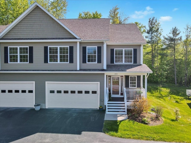 28A Black Walnut Ln Unit A, Jericho, VT 05465 - view of front of property with asphalt driveway, covered porch, an attached garage, a shingled roof, and a front lawn
