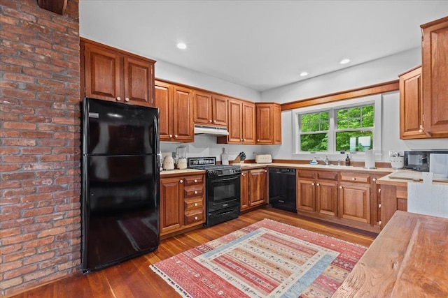 1444 Upper Hollow Rd, Stowe, VT 05672 - kitchen with black appliances, under cabinet range hood, dark wood finished floors, light countertops, and a sink