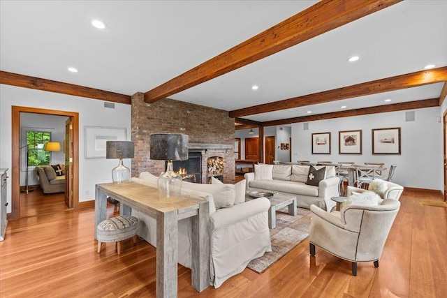 1444 Upper Hollow Rd, Stowe, VT 05672 - living room with beamed ceiling, light wood-style floors, recessed lighting, baseboards, and a fireplace