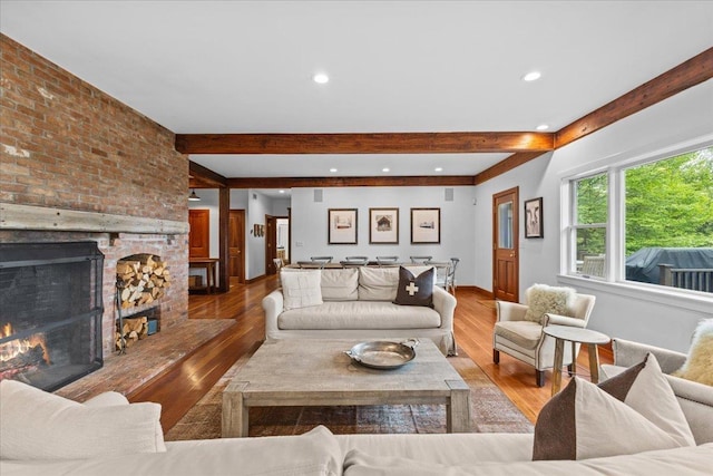 1444 Upper Hollow Rd, Stowe, VT 05672 - living room featuring beamed ceiling, a brick fireplace, wood finished floors, recessed lighting, and baseboards