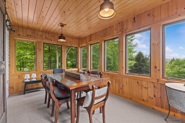 1444 Upper Hollow Rd, Stowe, VT 05672 - sunroom / solarium with healthy amount of natural light, carpet flooring, wooden walls, wooden ceiling, and baseboards