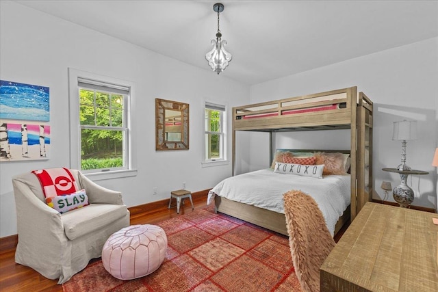 1444 Upper Hollow Rd, Stowe, VT 05672 - bedroom featuring wood finished floors, a chandelier, and baseboards