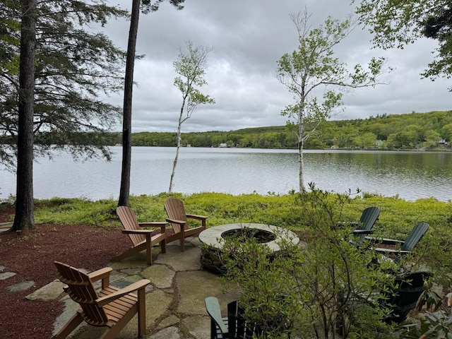 241 Skatutakee Rd, Harrisville, NH 03450 - view of patio with a fire pit, a water view, and a view of trees