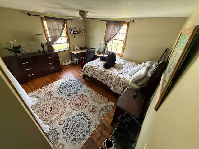 18 Caron Ave, Nashua, NH 03064 - bedroom featuring wood finished floors and a baseboard radiator