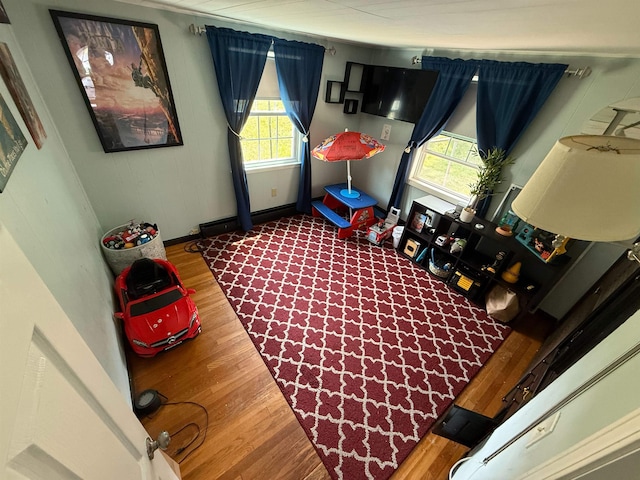 18 Caron Ave, Nashua, NH 03064 - rec room with dark wood-type flooring, healthy amount of natural light, and baseboards