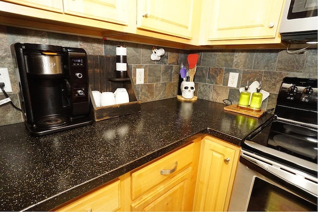 602 Silver St Unit 5, Manchester, NH 03103 - kitchen with electric stove, tasteful backsplash, and dark countertops