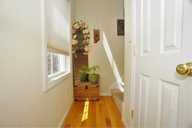 602 Silver St Unit 5, Manchester, NH 03103 - corridor featuring light wood-style flooring, stairway, and baseboards