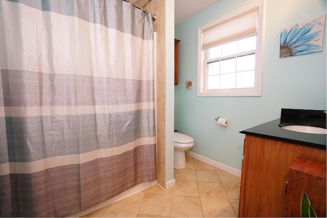 602 Silver St Unit 5, Manchester, NH 03103 - bathroom with toilet, vanity, tile patterned flooring, baseboards, and a shower with curtain
