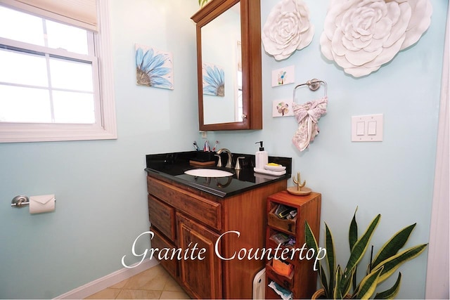 602 Silver St Unit 5, Manchester, NH 03103 - bathroom with vanity, baseboards, and tile patterned floors