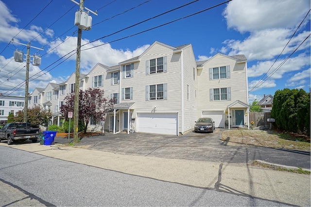 602 Silver St Unit 5, Manchester, NH 03103 - view of property featuring driveway, a residential view, and a garage