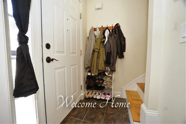 602 Silver St Unit 5, Manchester, NH 03103 - doorway featuring tile patterned flooring, stairway, and baseboards