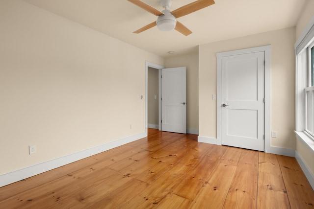 456 Thomas Ln, Stowe, VT 05672 - unfurnished bedroom featuring light wood-style floors, baseboards, and ceiling fan