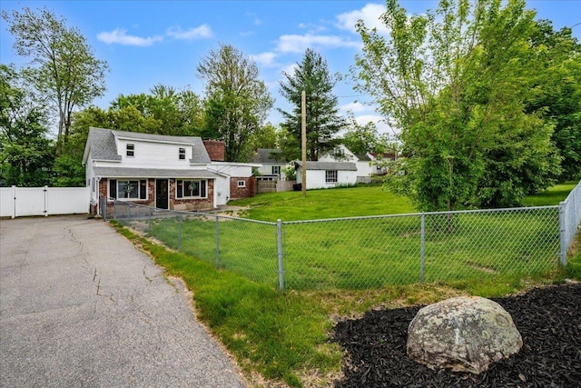 27 Eden St, Goffstown, NH 03102 - view of front of house featuring a gate, a porch, a chimney, and brick siding