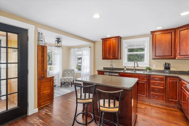 27 Eden St, Goffstown, NH 03102 - kitchen featuring a sink, dark countertops, dark wood-style flooring, a kitchen island, and recessed lighting