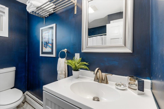27 Eden St, Goffstown, NH 03102 - bathroom featuring baseboard heating, toilet, and vanity