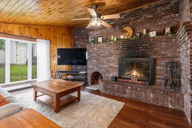 27 Eden St, Goffstown, NH 03102 - living room featuring a brick fireplace, wooden ceiling, a ceiling fan, hardwood / wood-style flooring, and wooden walls