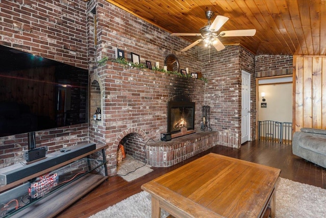 27 Eden St, Goffstown, NH 03102 - living area with a brick fireplace, wood ceiling, hardwood / wood-style flooring, ceiling fan, and brick wall