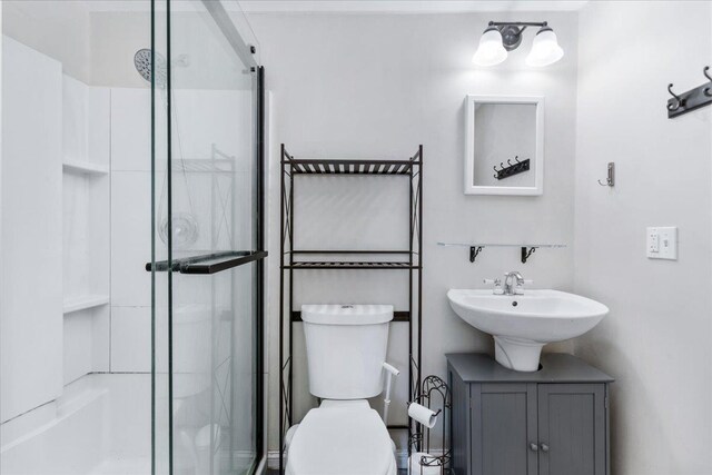 27 Eden St, Goffstown, NH 03102 - full bathroom featuring a shower stall, toilet, and a sink