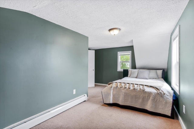 27 Eden St, Goffstown, NH 03102 - carpeted bedroom featuring a baseboard heating unit, a textured ceiling, and baseboards