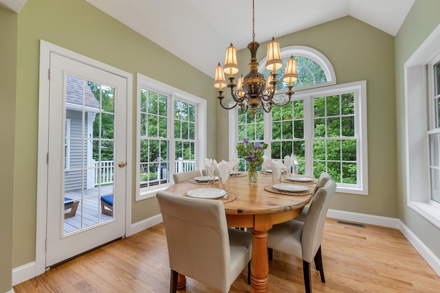 15 Largo Knl, Milford, NH 03055 - dining area with a chandelier, light wood-type flooring, vaulted ceiling, and baseboards