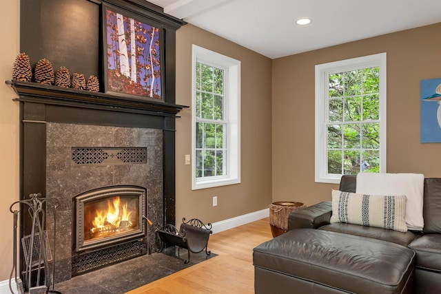 15 Largo Knl, Milford, NH 03055 - living area featuring a tile fireplace, wood finished floors, baseboards, and recessed lighting