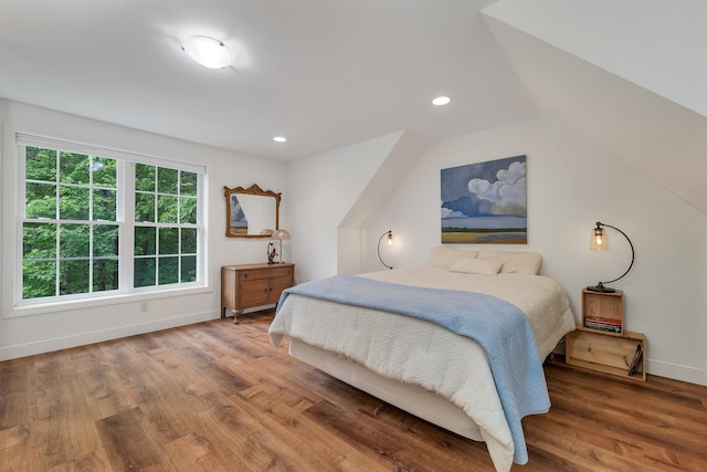 15 Largo Knl, Milford, NH 03055 - bedroom with baseboards, wood finished floors, lofted ceiling, and recessed lighting