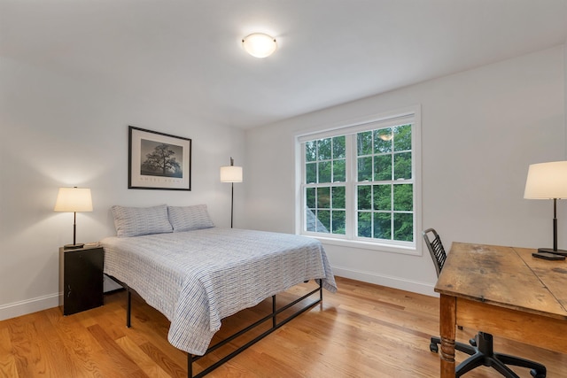 15 Largo Knl, Milford, NH 03055 - bedroom with baseboards, light wood-style floors, and an office area