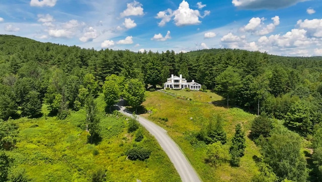 1452 Little Sunapee Rd, New London, NH 03257 - aerial view of property and surrounding area featuring a heavily wooded area