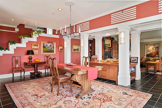 1452 Little Sunapee Rd, New London, NH 03257 - dining room with decorative columns, a chandelier, recessed lighting, and dark tile patterned floors