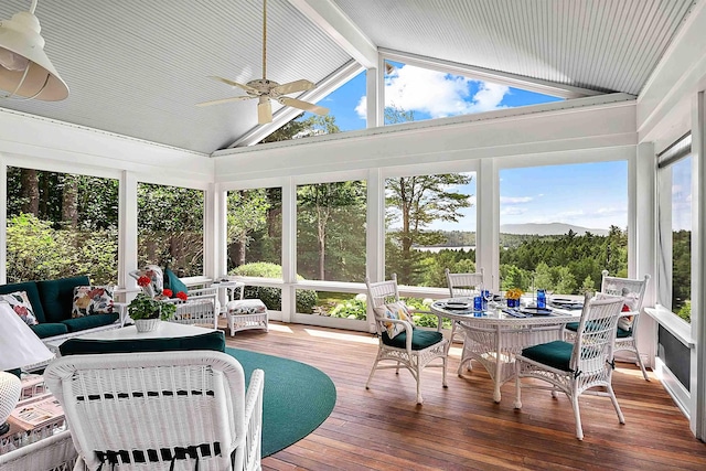 1452 Little Sunapee Rd, New London, NH 03257 - sunroom featuring a deck with mountain view, hardwood / wood-style floors, beam ceiling, and high vaulted ceiling