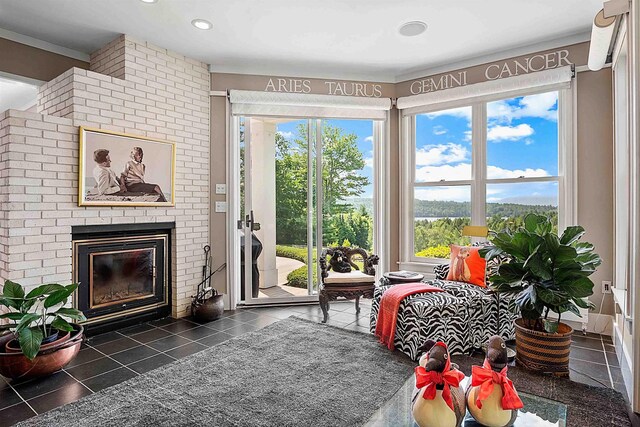 1452 Little Sunapee Rd, New London, NH 03257 - tiled living room with a brick fireplace and recessed lighting