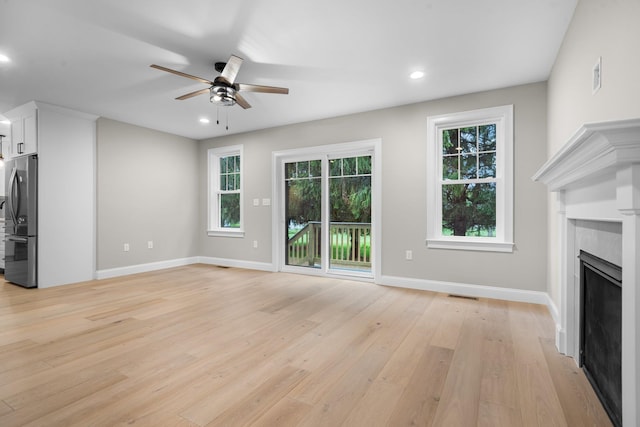 214 Pembroke St Unit A, Pembroke, NH 03275 - unfurnished living room featuring ceiling fan, light wood finished floors, a fireplace, recessed lighting, and baseboards