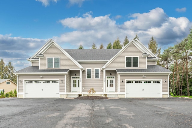 214 Pembroke St Unit A, Pembroke, NH 03275 - view of front of property featuring a garage, asphalt driveway, and roof with shingles