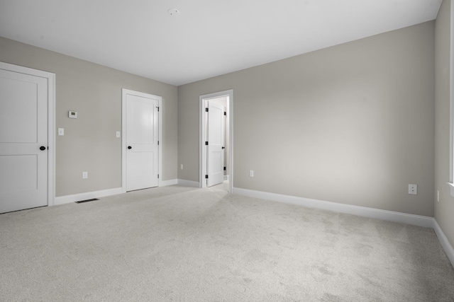 214 Pembroke St Unit A, Pembroke, NH 03275 - unfurnished bedroom featuring light colored carpet and baseboards