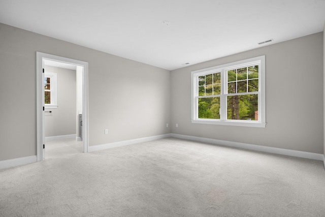 214 Pembroke St Unit A, Pembroke, NH 03275 - spare room featuring light colored carpet and baseboards