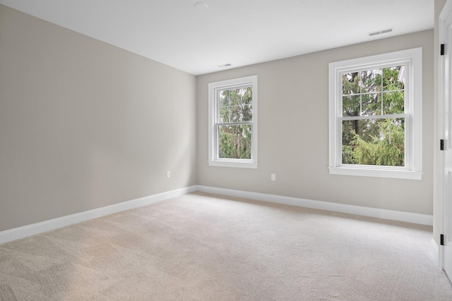 214 Pembroke St Unit A, Pembroke, NH 03275 - empty room with light carpet and baseboards