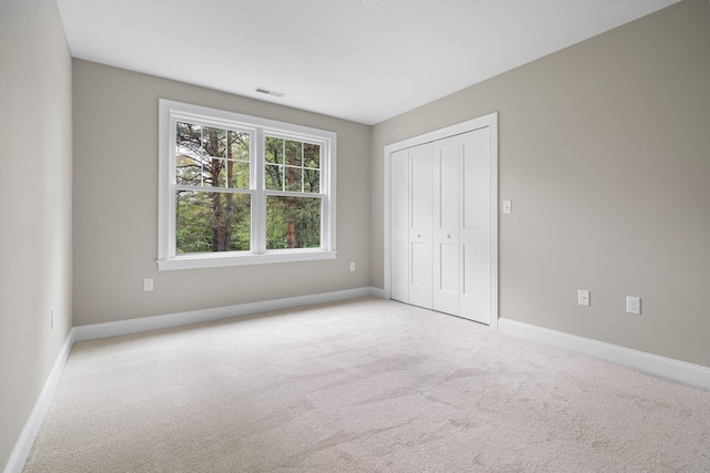 214 Pembroke St Unit A, Pembroke, NH 03275 - unfurnished bedroom featuring carpet flooring, baseboards, and a closet