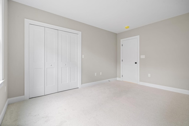 214 Pembroke St Unit A, Pembroke, NH 03275 - unfurnished bedroom featuring carpet flooring, baseboards, and a closet