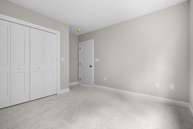214 Pembroke St Unit A, Pembroke, NH 03275 - unfurnished bedroom featuring carpet, a closet, and baseboards