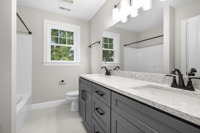 214 Pembroke St Unit A, Pembroke, NH 03275 - bathroom featuring double vanity, tub / shower combination, baseboards, toilet, and tile patterned floors
