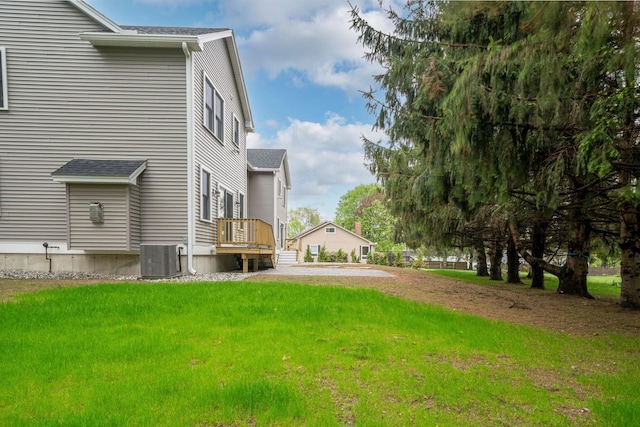 214 Pembroke St Unit A, Pembroke, NH 03275 - view of grassy yard featuring central AC unit and a deck
